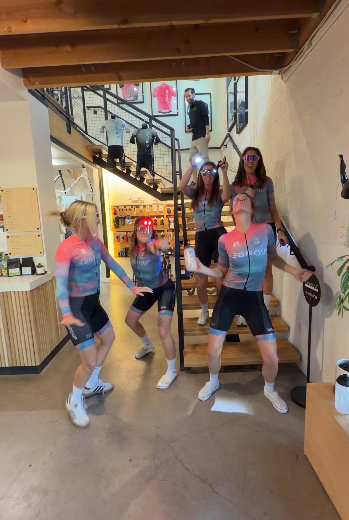 Regroup Women showing their team kits at Regroup Coffee and Bicycles